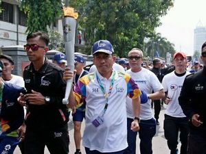 Askrindo Meriahkan Kirab Obor Asian Games