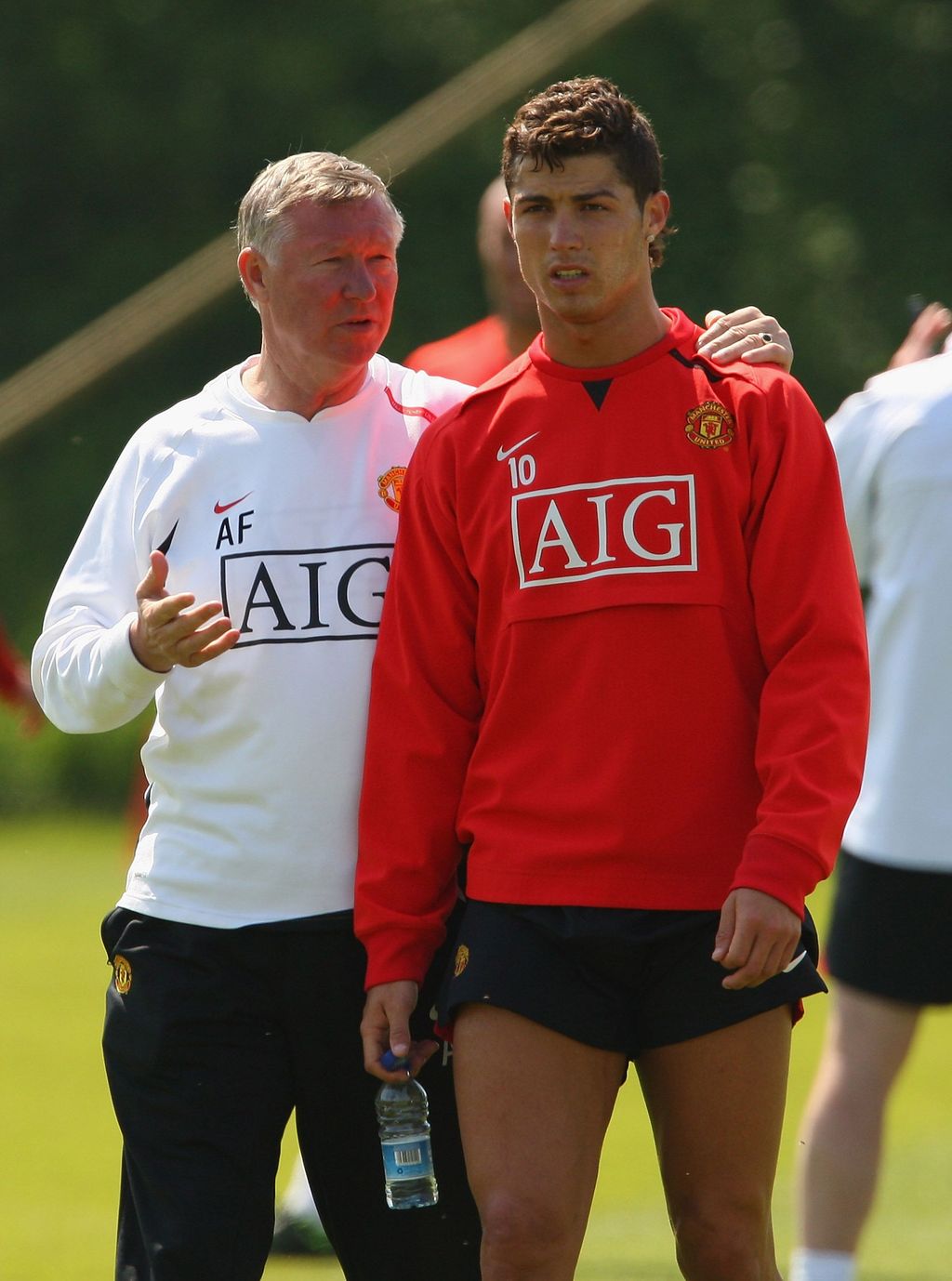 MANCHESTER, UNITED KINGDOM - MAY 15:  Sir Alex Ferguson the manager of Manchester United talks with Cristiano Ronaldo ahead of the UEFA Champions League Final during the Manchester United media day held at the Carrington Training Complex on May 15, 2008 in Manchester, England.  (Photo by Alex Livesey/Getty Images)