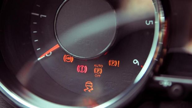 Many different car dashboard lights in closeup