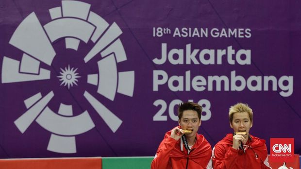 Kevin/Marcus usai meraih emas di Asian Games 2018.