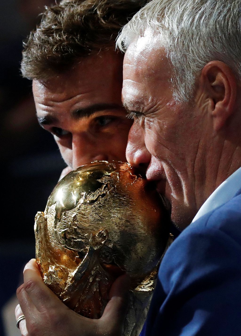 Soccer Football - UEFA Nations League - League A - Group 1 - France v Netherlands - Stade de France, Saint-Denis, France - September 9, 2018  France coach Didier Deschamps and Antoine Griezmann kiss the World Cup trophy during a ceremony after the match  REUTERS/Charles Platiau
