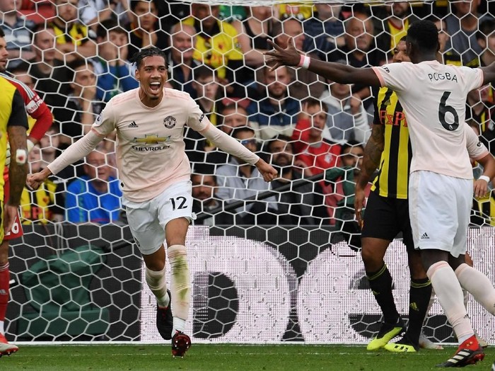 WATFORD, ENGLAND - SEPTEMBER 15:  Chris Smalling of Manchester United celebrates after scoring their second goal during the Premier League match between Watford FC and Manchester United at Vicarage Road on September 15, 2018 in Watford, United Kingdom.  (Photo by Ross Kinnaird/Getty Images)
