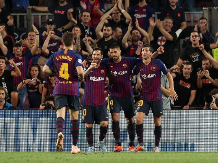 Soccer Football - Champions League - Group Stage - Group B - FC Barcelona v PSV Eindhoven - Camp Nou, Barcelona, Spain - September 18, 2018  Barcelona's Lionel Messi celebrates with Luis Suarez, Sergi Roberto and Ivan Rakitic after scoring their third goal   REUTERS/Albert Gea