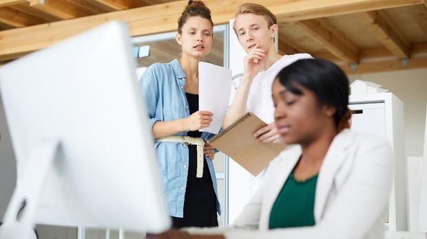 Colleagues discussing new employee