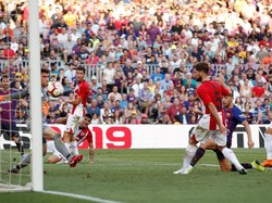 Munir El Haddadi menyamakan skor menjadi 1-1. Dia melesakkan gol setelah mendapat umpan dari Messi di menit ke-84. (Foto: Albert Gea/Reuters)