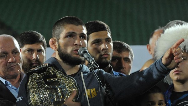 Russias Khabib Nurmagomedov, UFC lightweight champion who defeated Conor McGregor of Ireland in the main event of UFC 229, speaks during the ceremony of honouring him at Anzhi Arena in Kaspiysk, a city in the republic of Dagestan, Russia October 8, 2018. Picture taken October 8, 2018. REUTERS/Said Tsarnayev