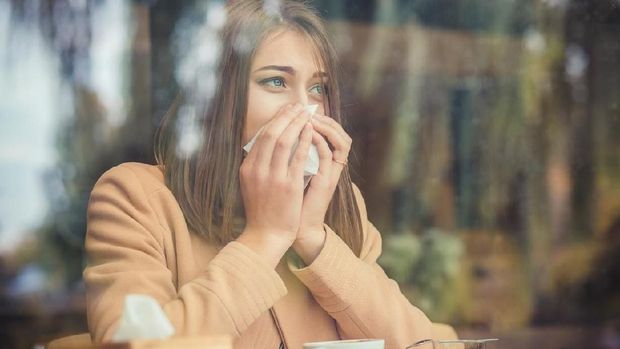 Young woman got nose allergy, flu sneezing nose