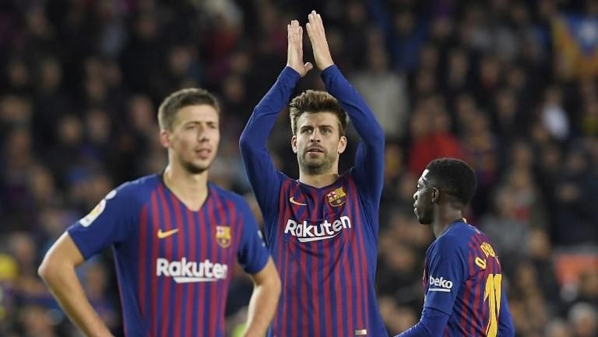Gerard Pique usai Barcelona menang 5-1 atas Real Madrid di El Clasico (Foto: LLUIS GENE / AFP)