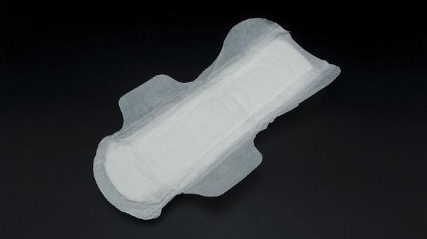 White clean hygiene sanitary napkin which soft and comfortable gently to skin on black background.