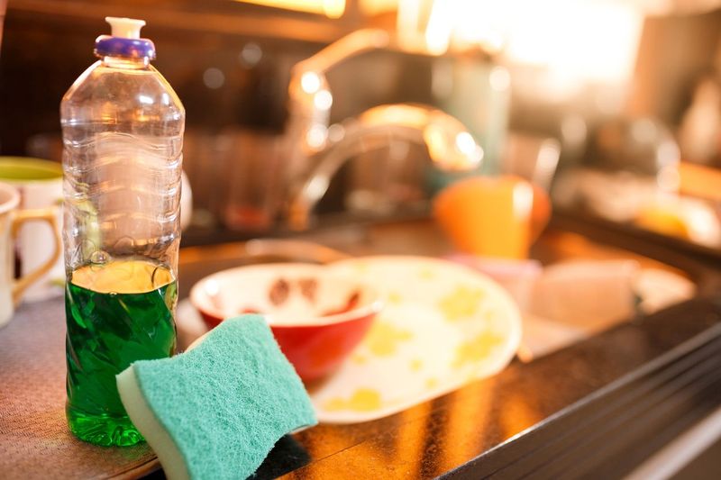 Dirty dishes in a messy sink