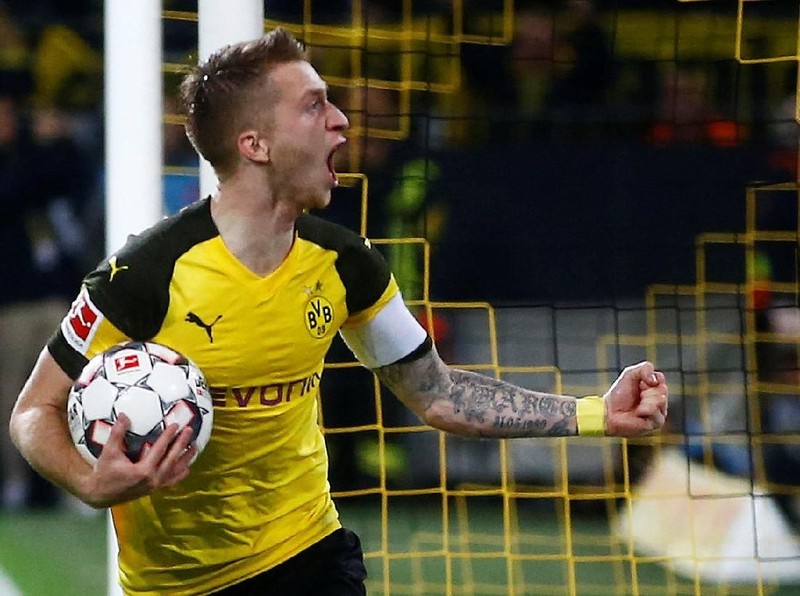 Soccer Football - Bundesliga - Borussia Dortmund v Bayern Munich - Signal Iduna Park, Dortmund, Germany - November 10, 2018  Borussia Dortmund's Marco Reus celebrates scoring their first goal         REUTERS/Wolfgang Rattay  DFL regulations prohibit any use of photographs as image sequences and/or quasi-video