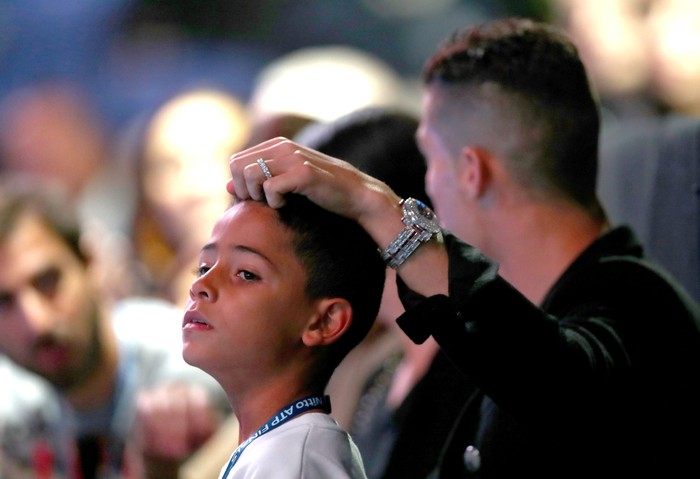 LONDON, ENGLAND - NOVEMBER 12:  Cristiano Ronaldo and son Cristiano Ronaldo Jr. watch on during the singles round robin match between Novak Djokovic of Serbia and John Isner of The United States during Day Two of the Nitto ATP World Tour Finals at The O2 Arena on November 12, 2018 in London, England.  (Photo by Naomi Baker/Getty Images)
