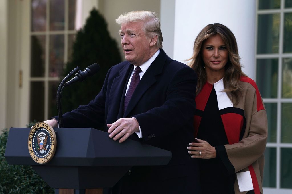 WASHINGTON, DC - NOVEMBER 20: U.S. President Donald Trump (R) and first lady Melania Trump (L) arrive at a turkey pardoning event at the Rose Garden of the White House November 20, 2018 in Washington, DC. The two turkeys, Peas and Carrots, will spend the rest of their lives in a farm after the annual Thanksgiving presidential tradition today.   (Photo by Alex Wong/Getty Images)