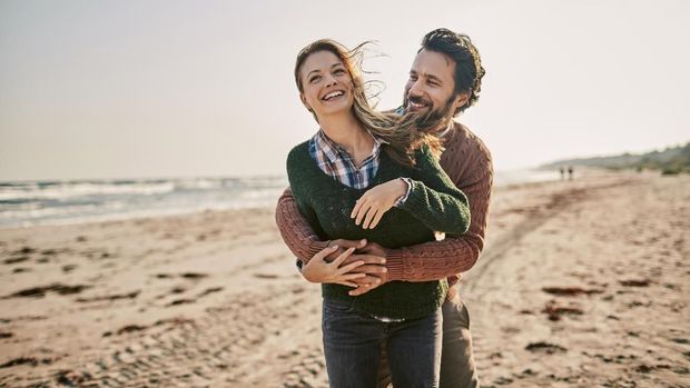 Close up of a young couple enjoying time on the beach