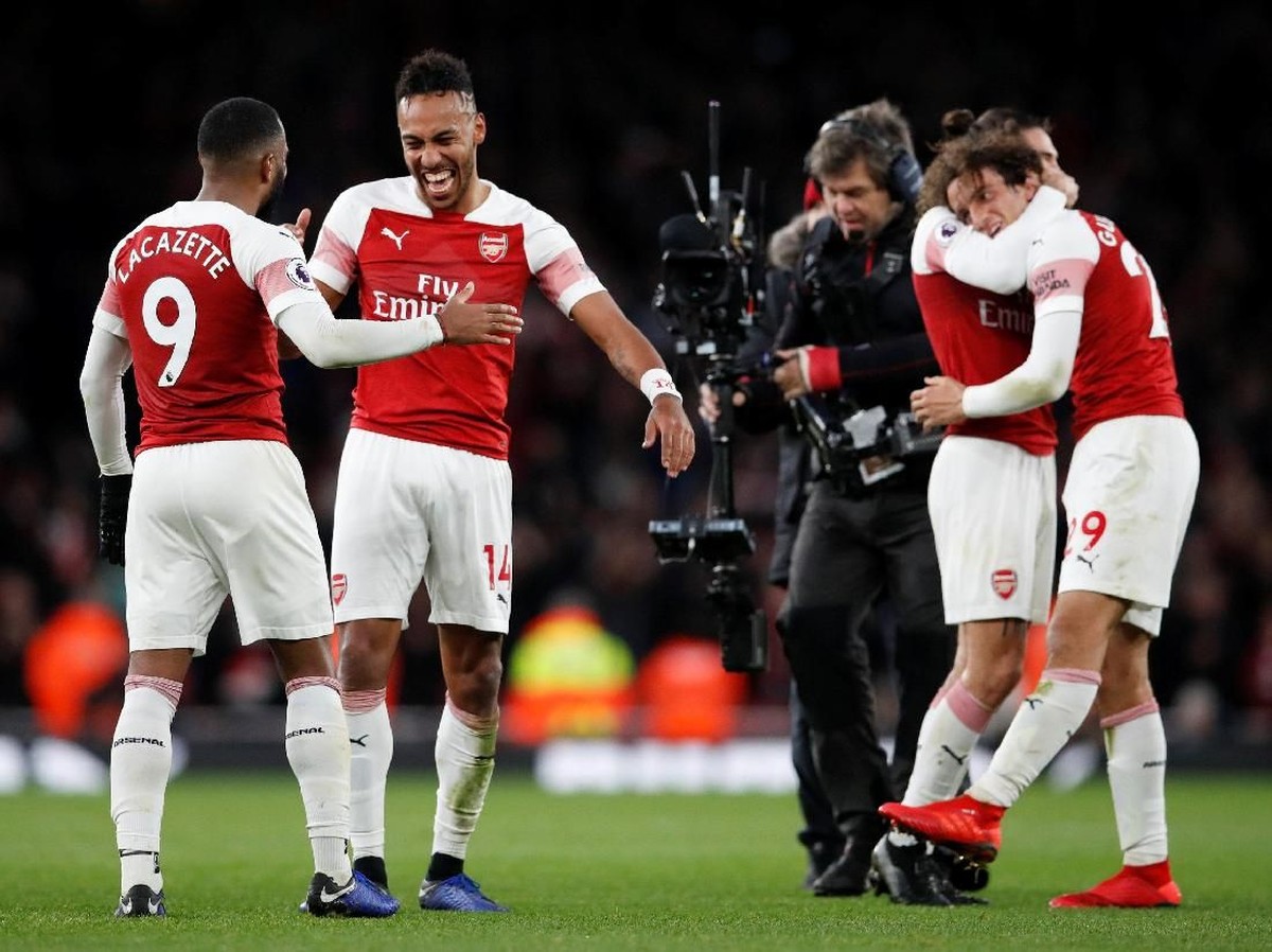 Pemain Arsenal merayakan kemenangan atas Tottenham Hotspur. (Foto: David Klein/Reuters)