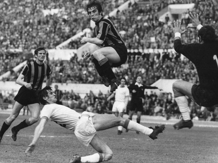 Inter Milan centre-forward Pino Boninsegna leaps high over Lazio's Giorgio Papadopulo during their match at the Olympic Stadium in Rome. On the left is Inter Milan's Giacinto Facchetti and on the right Lazio's goalkeeper Rosario di Vencenzo.   (Photo by Keystone/Getty Images)