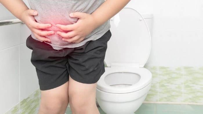 ilustrasi anak diare fat boy suffer stomach and sit in toilet, diarrhea constipation and health concept diare