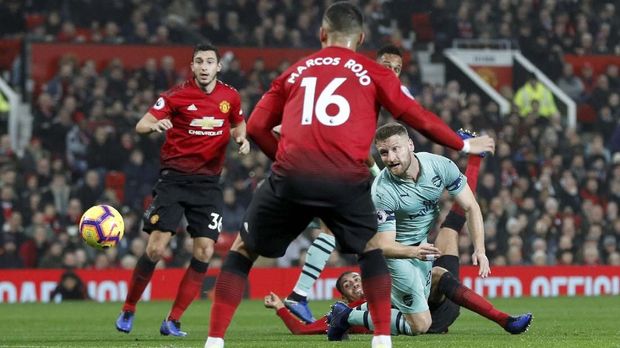 Manchester United bermain imbang dengan Arsenal dalam laga terakhir.