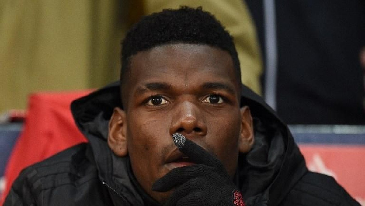 Paul Pogba mengunggah foto tersenyum di Twitter tak lama setelah Jose Mourinho dipecat Manchester United. (Foto: Oli Scarff/ AFP Photo)