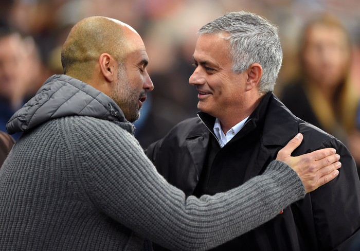 MANCHESTER, ENGLAND - NOVEMBER 11:  Josep Guardiola, Manager of Manchester City and Jose Mourinho, Manager of Manchester United embrace prior to the Premier League match between Manchester City and Manchester United at Etihad Stadium on November 11, 2018 in Manchester, United Kingdom.  (Photo by Mike Hewitt/Getty Images)