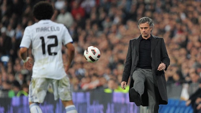 marcelo jose mourinho real madrid MADRID, SPAIN - FEBRUARY 06: Head coach Jose Mourinho of Real Madrid kicks the ball back during the La Liga match between Real Madrid and Real Sociedad at Estadio Santiago Bernabeu on February 6, 2011 in Madrid, Spain. (Photo by Denis Doyle/Getty Images)