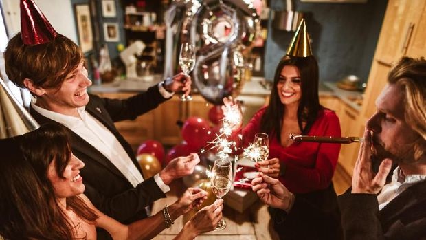 Happy friends celebrating the New Year.