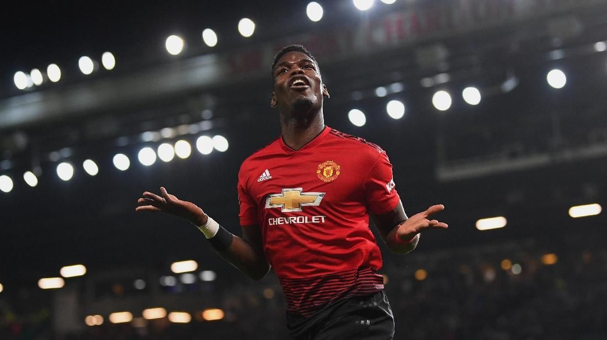 Paul Pogba bikin empat gol dan tiga assist dari tiga pertandingan Manchester United bersama Ole Gunnar Solskjaer (Michael Regan/Getty Images)
