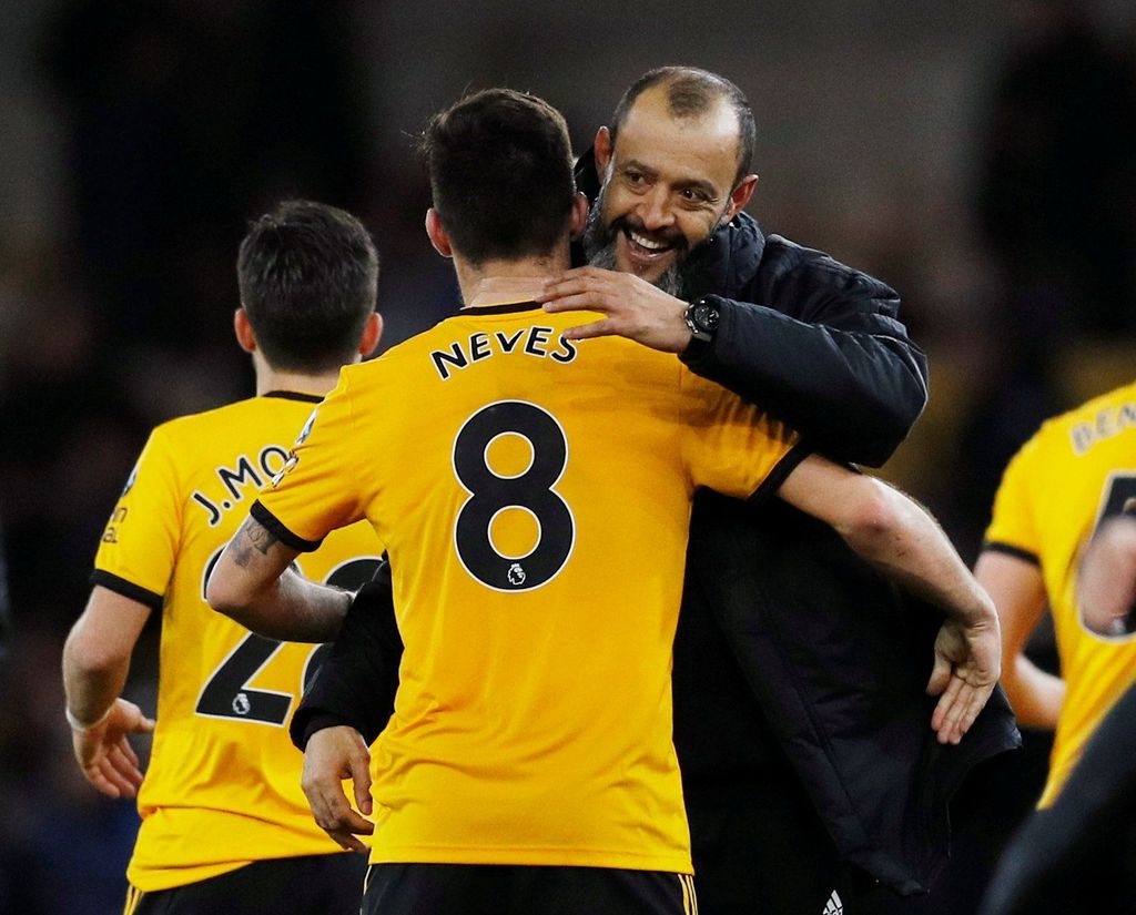 Soccer Football - FA Cup Third Round - Wolverhampton Wanderers v Liverpool - Molineux Stadium, Wolverhampton, Britain - January 7, 2019  Wolverhampton Wanderers manager Nuno Espirito Santo and Wolverhampton Wanderers' Ruben Neves celebrate after the match        REUTERS/Darren Staples