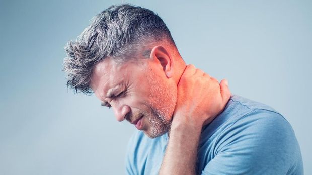 Young man suffering from neck pain. Headache pain.