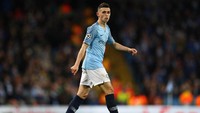 Phil Foden menjadi andalan Manchester City musim ini. Gelandang Inggris yang masih berusia 18 tahun itu tampil 26 kali musim ini dan mencetak 7 gol. Ia pun turut mengantar The Citizen menjuarai Liga Inggris dan Piala Liga. (Foto: Michael Steele/Getty Images)