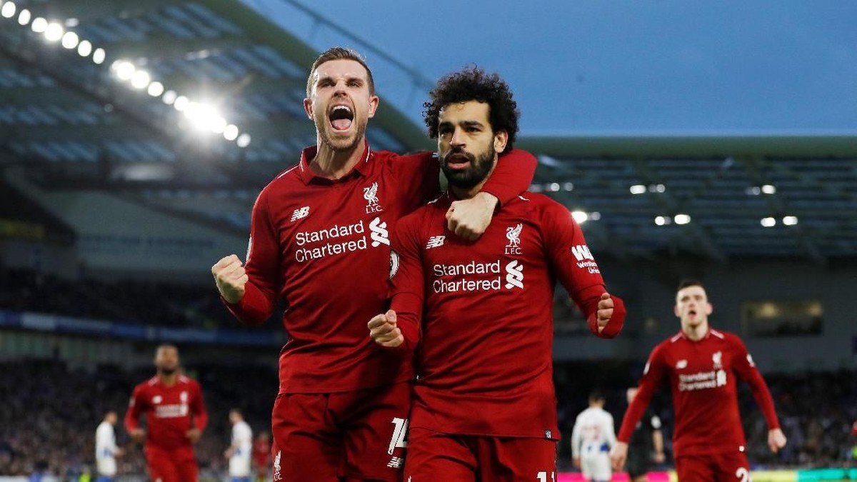 Jordan Henderson merayakan gol Mohamed Salah ke gawang Brighton (Paul Childs/Action Images via Reuters)
