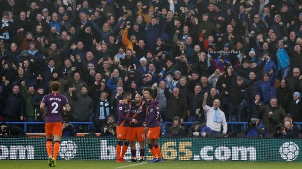 Manchester City mendulang tiga poin di kandang Huddersfield Town. (