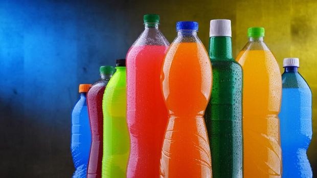 Plastic bottles of assorted carbonated soft drinks in variety of colors