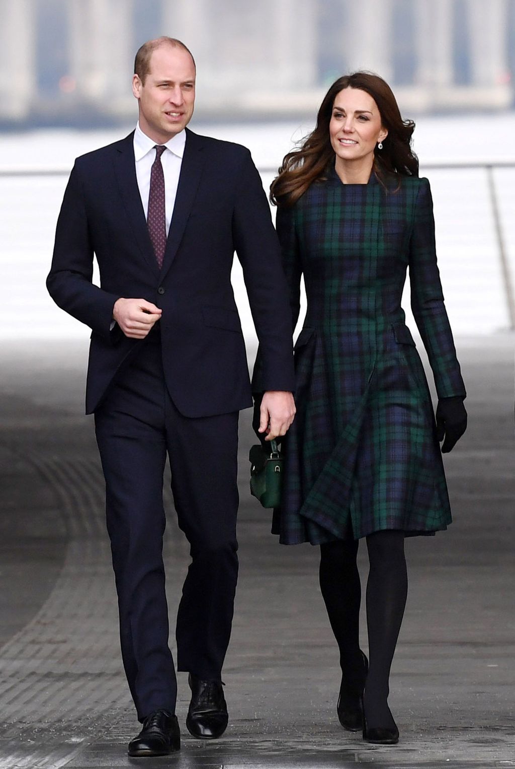 DUNDEE, SCOTLAND - JANUARY 29: Catherine, Duchess of Cambridge, who is known as the Duchess of Strathearn in Scotland, lets a girl touch her hair as she meets school children outside a community centre on January 29, 2019 in Dundee, Scotland. (Photo by Ian Rutherford - WPA Pool/Getty Images)