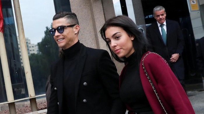 Portugals soccer player Cristiano Ronaldo leaves with his girlfriend Georgina Rodriguez after appearing in court on a trial for tax fraud in Madrid, Spain, January 22, 2019. REUTERS/Susana Vera