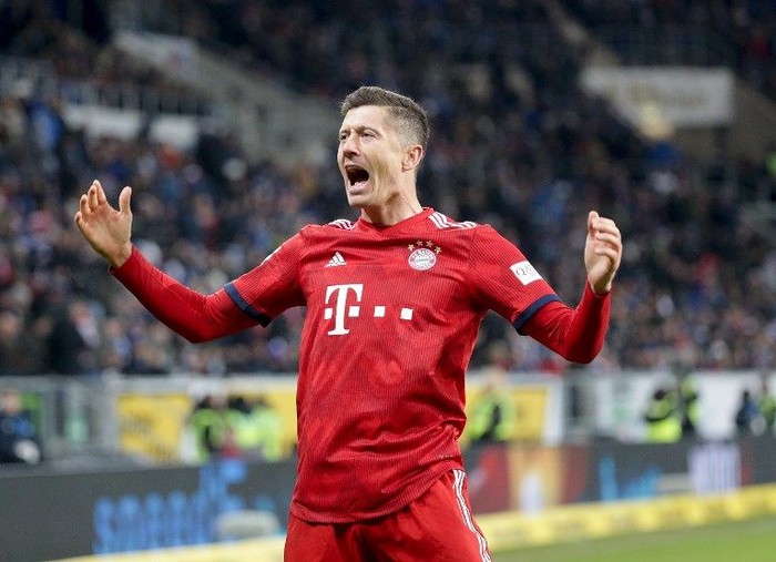 Bayern Munichs Polish forward Robert Lewandowski celebrates scoring during the German First division Bundesliga football match TSG 1899 Hoffenheim v FC Bayern Munich in Sinsheim, Germany, on January 18, 2019. (Photo by Hasan Bratic / dpa / AFP) / DFL REGULATIONS PROHIBIT ANY USE OF PHOTOGRAPHS AS IMAGE SEQUENCES AND/OR QUASI-VIDEO