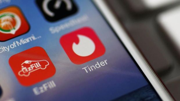 MIAMI, FL - AUGUST 14:  In this photo illustration, the icon for the dating app Tinder is seen on the screen of an iPhone on August 14, 2018 in Miami, Florida.  The co-founders of Tinder and eight other former and current executives of the dating app are suing the service's current owners for at least $2 billion.  (Photo illustration by Joe Raedle/Getty Images)