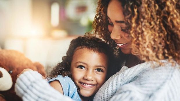 Shot of a beautiful mother and her adorable daughter bonding at home