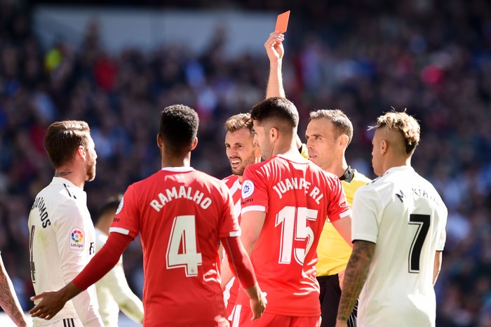 MADRID, SPAIN - FEBRUARY 17:  Sergio Ramos of Real Madrid is shown a red card by referee Santiago Bernabeu during the La Liga match between Real Madrid CF and Girona FC at Estadio Santiago Bernabeu on February 17, 2019 in Madrid, Spain.  (Photo by Denis Doyle/Getty Images)