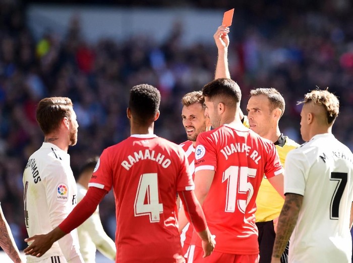 MADRID, SPAIN - FEBRUARY 17:  Sergio Ramos of Real Madrid is shown a red card by referee Santiago Bernabeu during the La Liga match between Real Madrid CF and Girona FC at Estadio Santiago Bernabeu on February 17, 2019 in Madrid, Spain.  (Photo by Denis Doyle/Getty Images)