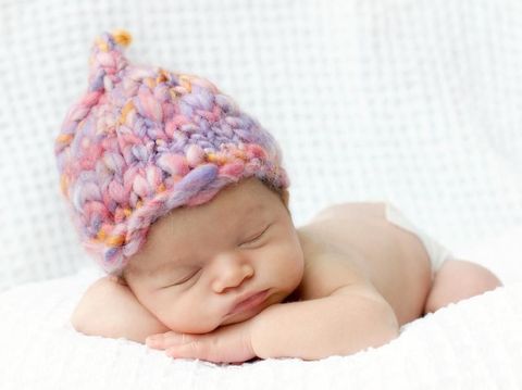 Baby Sleeping, Newborn Kid Sleep in Pink Clothing, New Born Child Asleep in Basket over Wood Background
