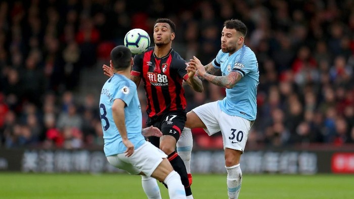 BOURNEMOUTH, ENGLAND - MARCH 02: Joshua King of AFC Bournemouth is challenged by Nicolas Otamendi of Manchester City during the Premier League match between AFC Bournemouth and Manchester City at Vitality Stadium on March 02, 2019 in Bournemouth, United Kingdom. (Photo by Catherine Ivill/Getty Images)