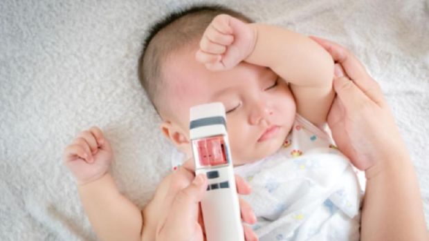 Blurred of image baby sick with thermometer