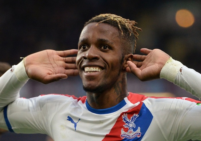 Soccer Football - Premier League - Burnley v Crystal Palace - Turf Moor, Burnley, Britain - March 2, 2019  Crystal Palaces Wilfried Zaha celebrates scoring their third goal   REUTERS/Peter Powell  EDITORIAL USE ONLY. No use with unauthorized audio, video, data, fixture lists, club/league logos or 