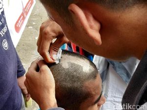 Buktikan Loyalitas, Relawan Jokowi di Kendari Cukur Angka 1