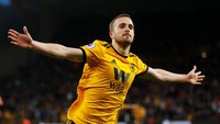 Arsenal terus mengambil kendali permainan di sisi waktu babak pertama. Alih-alih mencetak gol balasan, The Gunners malah kebobolan untuk ketiga kalinya, yang kali ini lewat Diogo Jota. Wolves menutup babak pertama dengan skor 3-0. Eddie Keogh/Reuters.