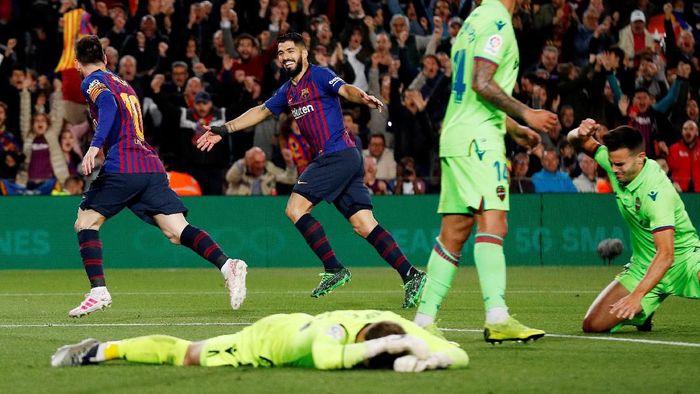 Lionel Messi merayakan gol ke gawang Levante. Barcelona menang 1-0 untuk mengunci gelar juara Liga Spanyol. (Foto: Albert Gea/Reuters)