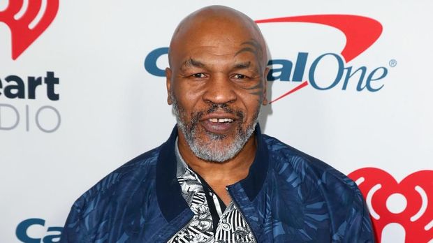 BURBANK, CALIFORNIA - JANUARY 18: (EDITORIAL USE ONLY. NO COMMERCIAL USE) Mike Tyson arrives at the 2019 iHeartRadio Podcast Awards Presented by Capital One at the iHeartRadio Theater LA on January 18, 2019 in Burbank, California.   Joe Scarnici/Getty Images for iHeartMedia/AFP