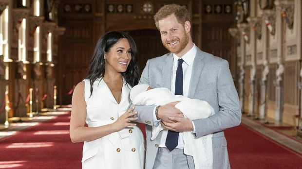 Britain's Prince Harry and Meghan, Duchess of Sussex, during a photocall with their newborn son, in St George's Hall at Windsor Castle, Windsor, south England, Wednesday May 8, 2019. Baby Sussex was born Monday at 5:26 a.m. (0426 GMT; 12:26 a.m. EDT) at an as-yet-undisclosed location. An overjoyed Harry said he and Meghan are 