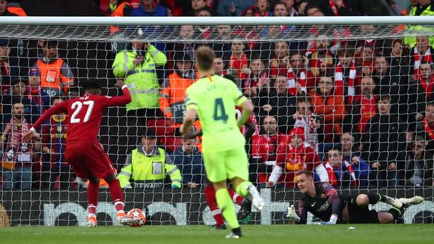 LIVERPOOL, ENGLAND - MAY 07:  Divock Origi (27) scores his team's first goal during the UEFA Champions League Semi Final second leg match between Liverpool and Barcelona at Anfield on May 07, 2019 in Liverpool, England. (Photo by Clive Brunskill/Getty Images)
